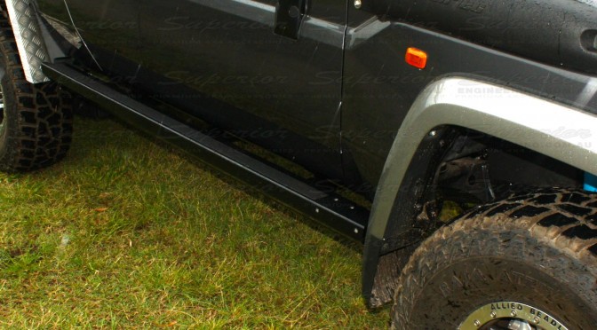 Close up view of some new Superior Stealth Rock Sliders on a Toyota Landcruiser 79 Series