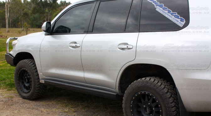 Rear left side view of a Superior Engineering Stealth Rock Slider fitted to a Toyota Landcruiser 200 Series