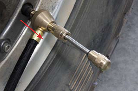 Slide hose collar away from valve stem