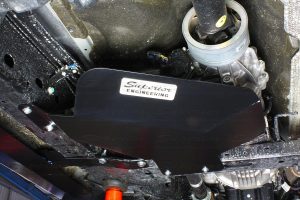 Closeup view of a Heavy Duty Transfer Case Guard fitted to the chassis and crossmember on a current model Ford Ranger 4WD