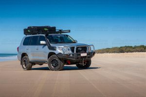 Right side view of a 200 Series Landcruiser on Bribie Island beach with the recovery point installed