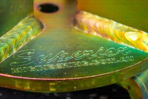 Closeup view of the Superior Engineering logo engraved onto the coil drop out cone main plate